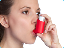 Person using a rescue inhaler. Role of Respiratory Inhalers in Asthma